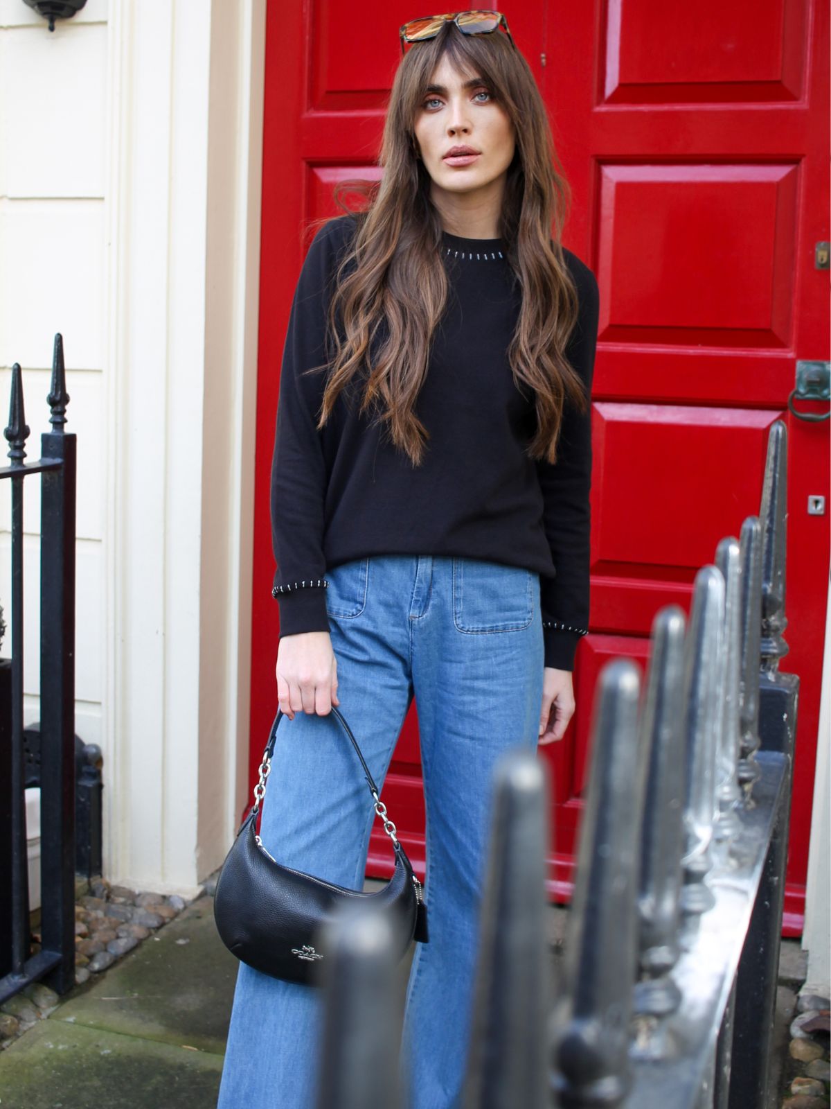 Black lightweight fine knit sweater with ivory blanket stitch