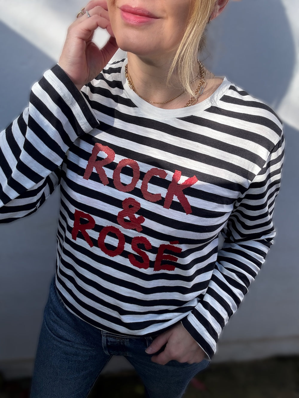 black and cream long sleeve stripe top with rock and rose slogan